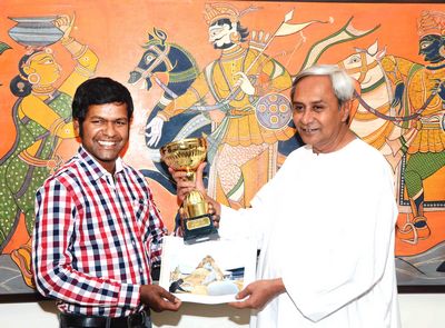 Chief Minister Shri Naveen Patnaik felicitating at Secretariat on 2-6-2012. Sudarshan recently won the Copenhagen International Sand Sculptor Championship held in DenmarkDate-02-Jun-2012 