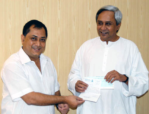 Shri Debasis Nayak, Minister I&PR and Youth Service hands over a cheque of one month salary to Chief Minister Shri Naveen Patnaik for Tsunami Victims.