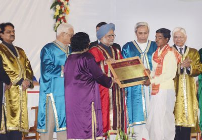 Honble Prime Minister of India Dr. Manmohan Singh felicitating to Chandra Pradhan Tribal of Karaput district on the occasion of 99th Indian Science Congress at KIIT University Bhubaneswar Date-03-Jan-2012