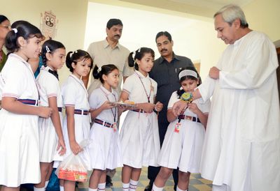 School Children tying Rakhi on the hands of Chief Minister Shri Naveen Patnaik at Naveen NewasDate-01-Aug-2012