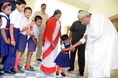 School Children tying Rakhi on the hands of Chief Minister Shri Naveen Patnaik at Naveen Newas Dated-01-Aug-2012