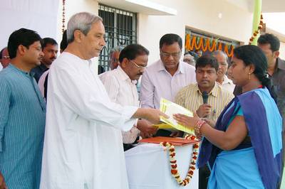 Chief Minister Shri Naveen Patnaik distributing Pattas of homestead Land at Kalampur, Kalahandi district