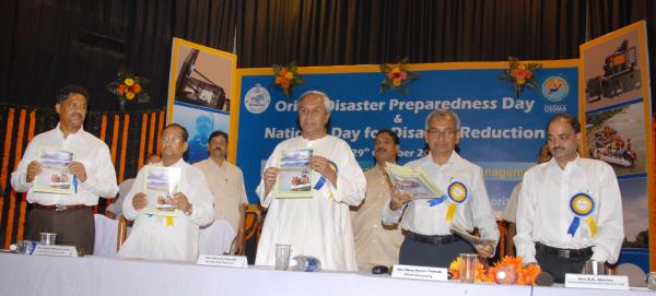 Chief Minister Shri Naveen Patnaik relishing  Annual Report on  the occasions of   observance of Orissa Disaster Preparedness Day & National Day for Disaster Reduction at Jaydev Bhawan.