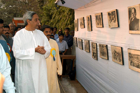 Naveen Patnaik going round a Photo exhibition on Netaji Subhas Chandra Bose at Revensha Collegiate School,Cuttack on the Occasion of Nataji`s 108th Bairth Anniversary.