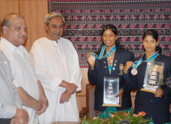 Naveen Patnaik felicitating to Pratima Puhana and Pramila Prava Minz who recently won Bronze medal in Rowing (Coxless pair) event at Asiad in China at Secretariat.