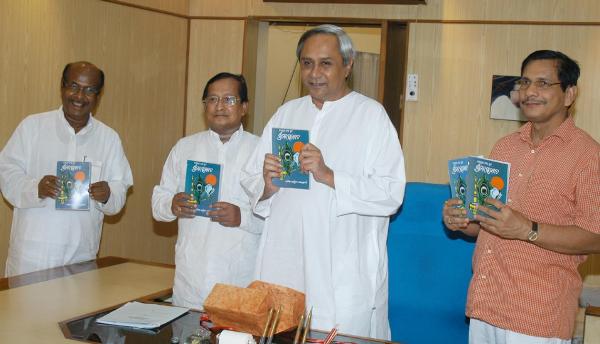 Naveen Patnaik relishing Book of �SRIMAD VAGABATA� published by Orissa Sahitya Academy at OLA Chief Ministers Chamber. 