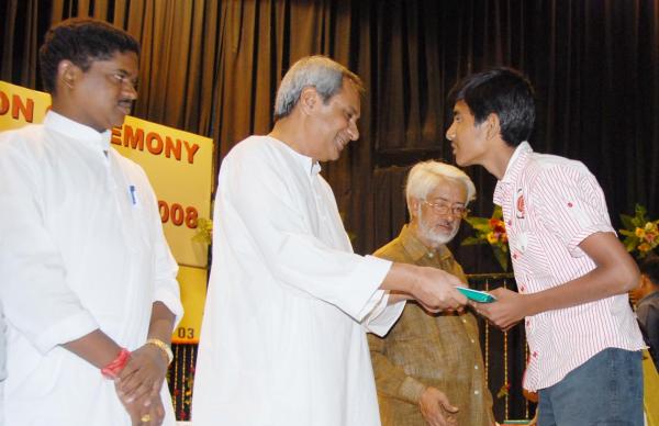 Naveen Patnaik giving away prizes to the winners of Indian National Mathematics Olympiad at Jaydev Bhawan.