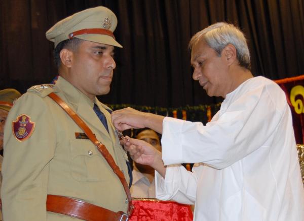 Naveen Patnaik giving away Police Medals to the Meritorious Police Officers at the investiture ceremony held at Jaydev Bhwan.