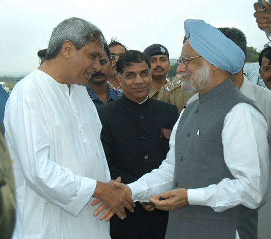 Naveen Patnaik, bidding farewell to Prime Minister Dr. Manmohan Singh at Biju Patnaik Airport.