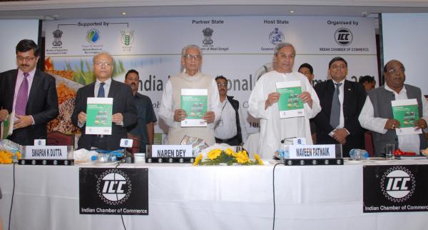 Naveen Patnaik releasing the ICC-YES Bank Report on the occasion of India International Crop Summit 2011 at Hotel May Fair, Bhubaneswar.